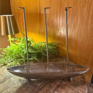 This metal vintage fishing lure rack designed to hold thread or fishing tackle